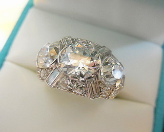 SUPERB DECO DIAMONDS RING, platinum, 3 primary diamonds 1.90, 1.20 & 1.20 carats