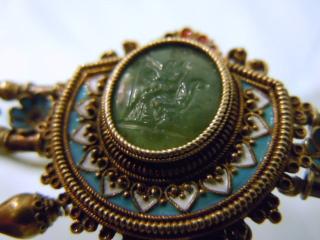 Center medalion, seated figure, intaglio-carved in green chalcedony