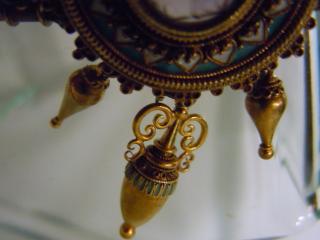 Detail, urns below the collar of blue, white and gold
