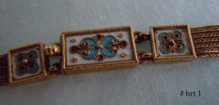 Three colors enamel, gold applied rosettes, granulation & wire-work