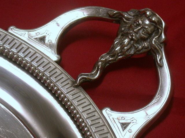 Tray, detail of one mask handle