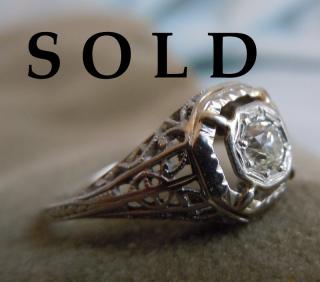 AMERICAN QUARTER CARAT OPENWORK DOME RING, 1920's