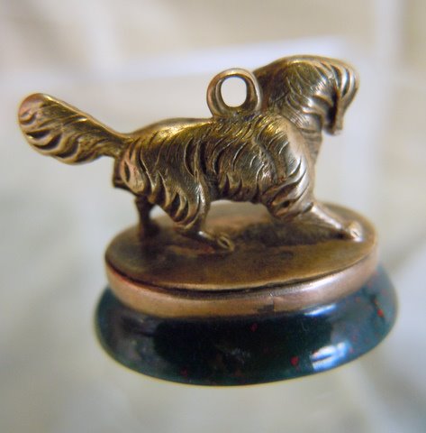 KING CHARLES SPANIEL, in miniature, on bloodstone seal base