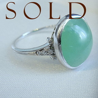 1920'S PLATINUM, DIAMONDS & GREEN JADE RING