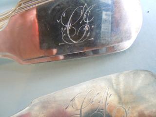 Family initials, in the script spray style, on table spoons