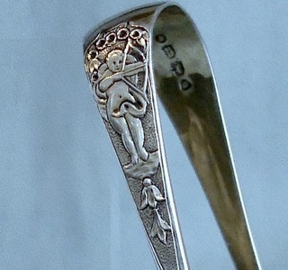 MISCHIEVOUS CUPID tea tongs, Victorian, 1851