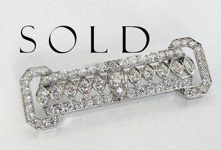 SIXTY-THREE DIAMONDS IN PLATINUM, a choice and perfect art deco brooch