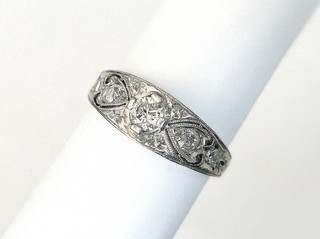 FIVE DIAMONDS PIERCED & ENGRAVED PLATINUM RING