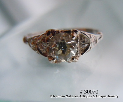 Total of the center plus four accent diamonds is .59 carat