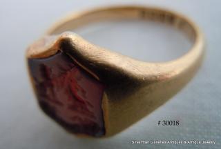 The carved seal & stone were most likely in a ring centuries older than the present (1919) one