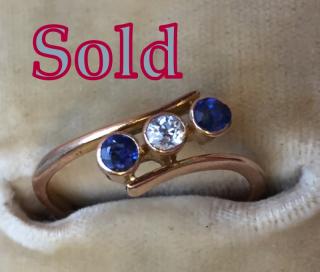 TWO VIVID BLUE SAPPHIRES and Diamond Three-Stone crossover ring