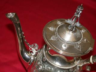 Coffee Pot lid detail, Tower finial above Orientalist palmettes and suspension cable to spout