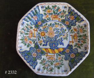 Hand painted tin glazed earthenware, on ribbed body