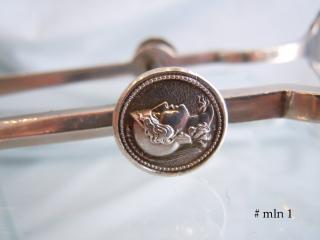 a smaller female profile medallion on one end of yoke
