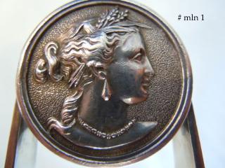 Female medallion, grains of wheat in hair symbolizing American prosperity
